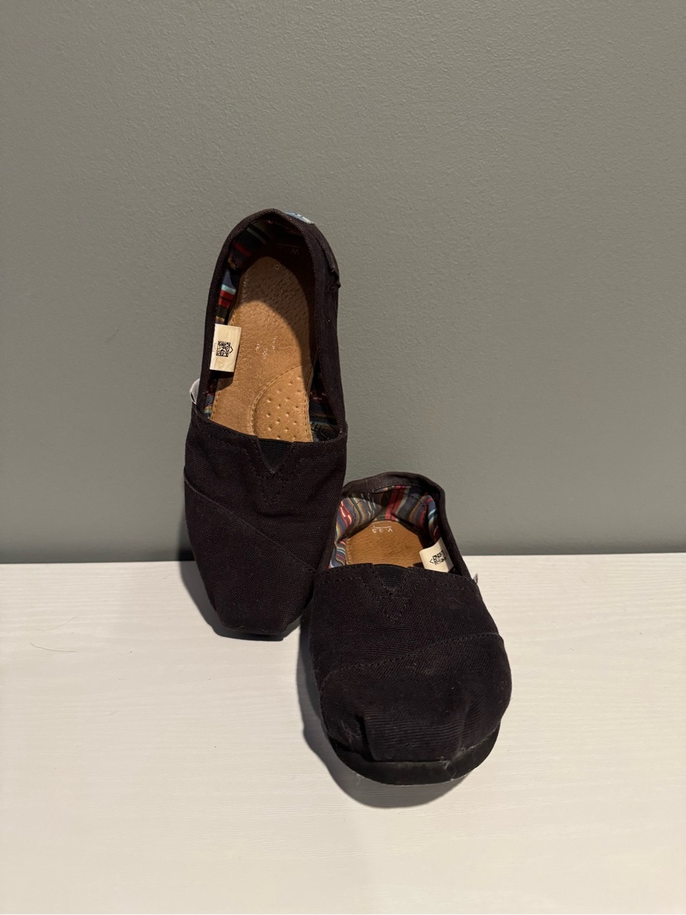 Black Slip-On TOMS Canvas Flats with Colorful Inner Lining
